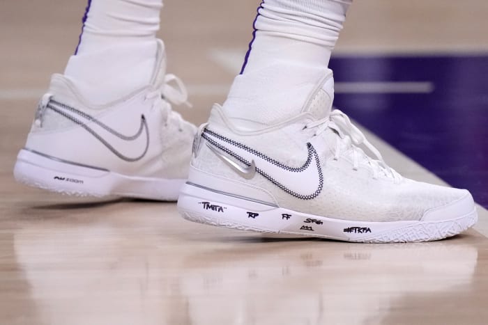View of LeBron James' white Nike shoes.